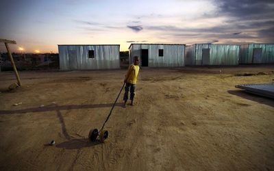 A young boy plays with his cart in the temporary housing settlement near Oudtshoorn. Transparent budgets raise confidence and provide an important measures to monitor service delivery. Picture: THE TIMES
